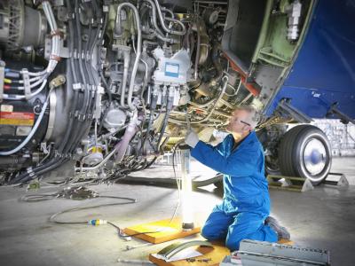 aircraft-engineer-repairing-engine-getty-150639564